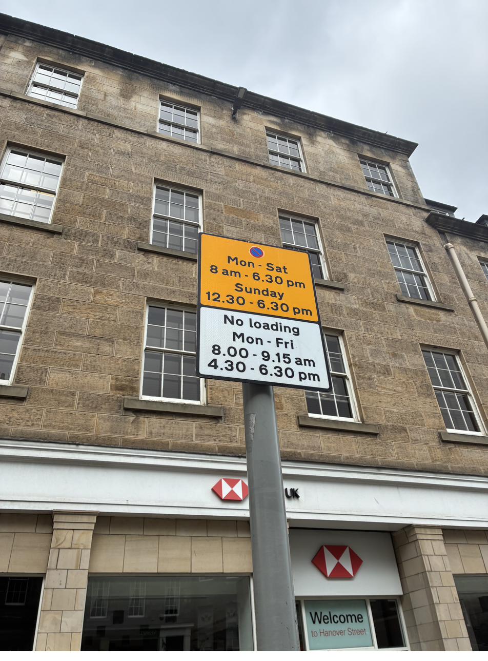 Edinburgh no waiting and no loading sign on Hanover Street showing Mon-Sat 8am-6:30pm, Sunday 12:30-6:30pm, and loading ban during peak hours